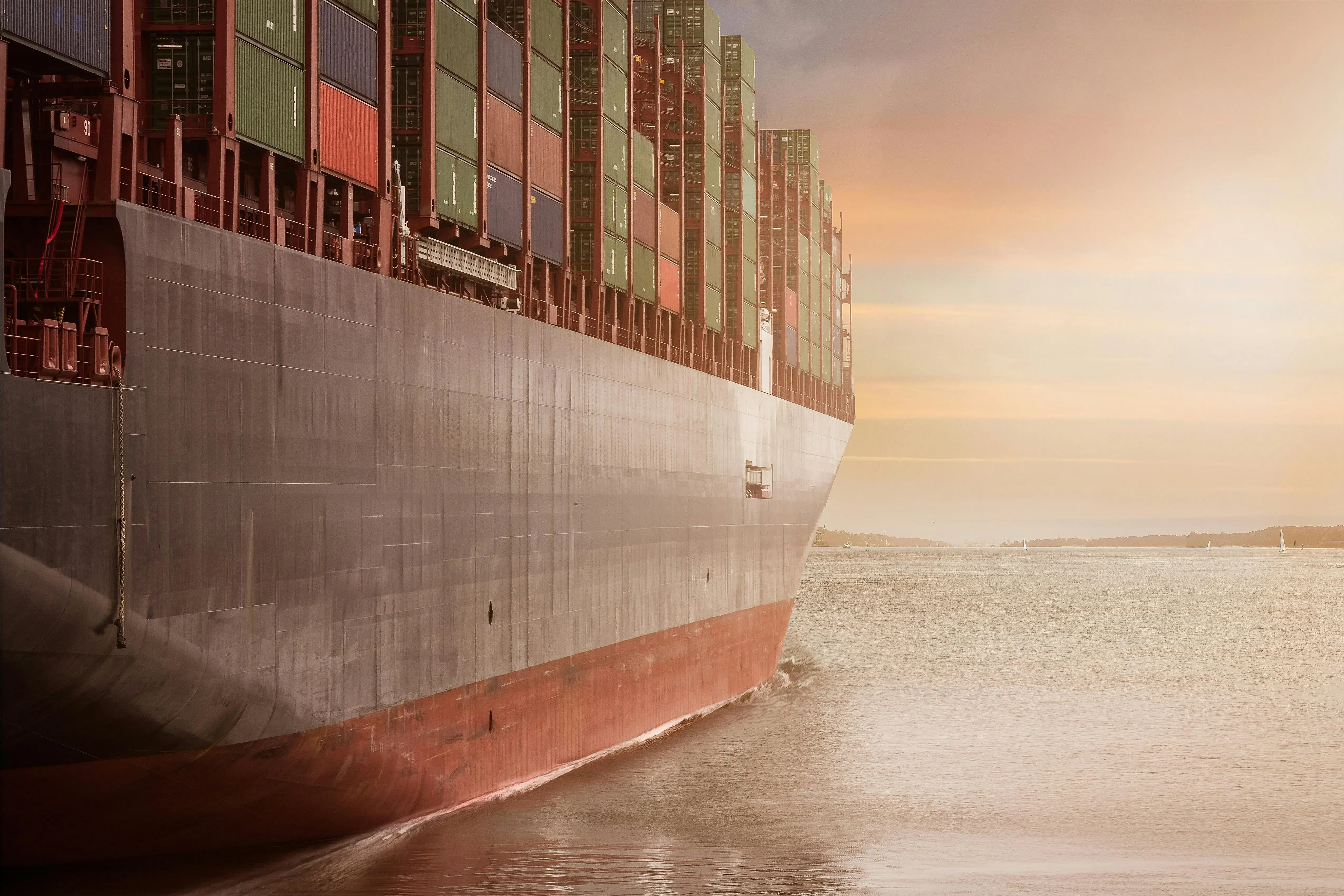 Shipping vessel on the horizon at dusk